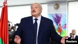 Belarusian President Alexander Lukashenko votes during the presidential election in Minsk