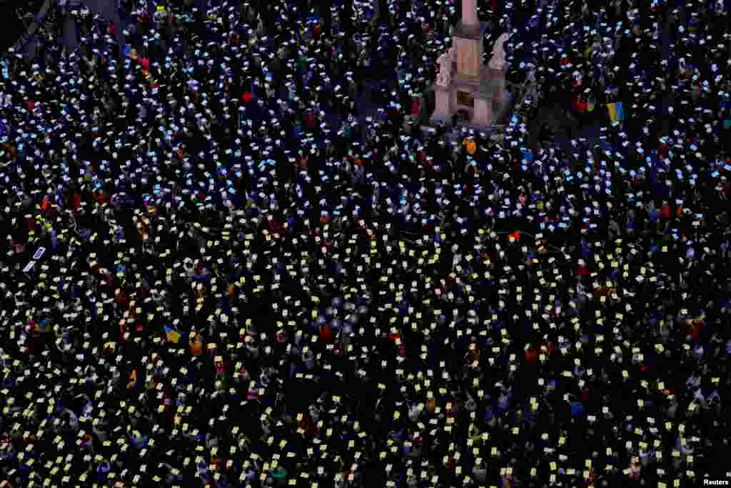 People attend a protest to mark the two-year anniversary of the Russian invasion of Ukraine, at the Old Town Square in Prague, Czech Republic, Feb. 24, 2024.