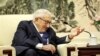 FILE - Former U.S. Secretary of State Henry Kissinger speaks during a meeting at the Great Hall of the People in Beijing, China, Nov. 22, 2019. The 100-year-old veteran U.S. diplomat also met with a Chinese official on Tuesday. (Jason Lee/Reuters/Pool Photo) 