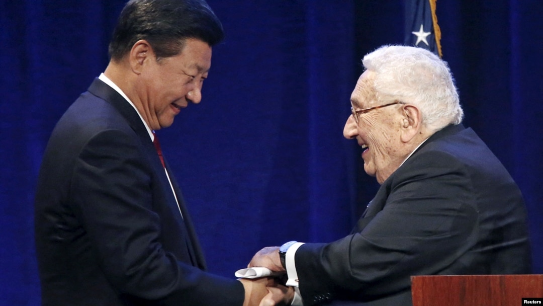 FILE - Chinese President Xi Jinping, left, shakes hands with former U.S. National Security Adviser and Secretary of State Henry Kissinger in Seattle, Washington, Sept. 22, 2015.