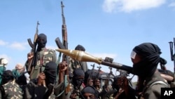 FILE - Armed al-Shabab fighters ride on pickup trucks just outside the Somali capital of Mogadishu, Dec. 8, 2008. Al-Shabab has reversed all Somali National Army gains made over the last two years, U.S. defense officials say.