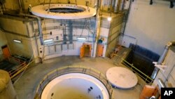 FILE - Technicians work on the Arak heavy water reactor's secondary circuit, near Arak, 250 kilometers southwest of Tehran, Iran, Dec. 23, 2019. (Atomic Energy Organization of Iran handout)