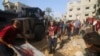 Palestinians pull a boy from the rubble after an Israeli strike on the Zaroub family house in Rafah, Gaza Strip, Oct. 24, 2023.