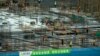 Construction workers work amid sections of rebar at a construction site in the central business district in Beijing, China, June 13, 2023. 