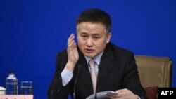 FILE - Deputy Governor of the People's Bank of China, Pan Gongsheng answers questions at news conference during the 12th National People's Congress (NPC) in Beijing on March 10, 2017.