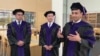 Behruz Shamsuddinov, right, speaks while Doniyorbek Davronov, middle, and Azizjon Jamolov from Penn State Law's Class of 2024 talk with VOA in State College, Pennsylvania, May 10, 2024.