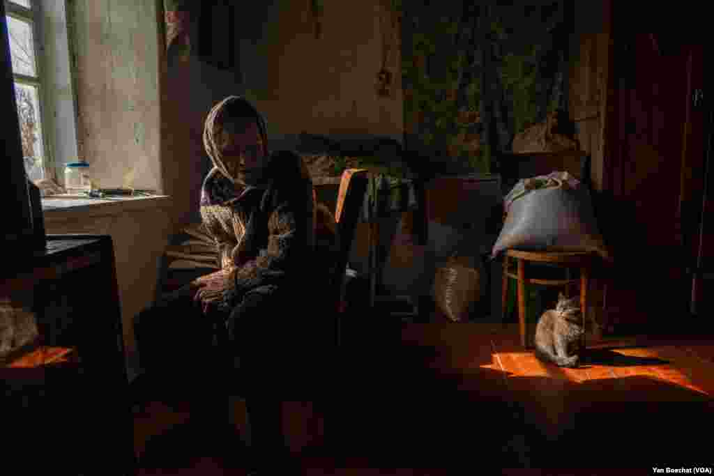 Paraskevia, 73, lives just 3 kilometers from the front lines. Shelling is constant, and she says she’s scared. Despite all the danger, she is staying in her home in Ocheretyno, March 4, 2024.