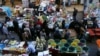 FILE - Iraqi Kurdish people walk in a street market in Erbil, in the Kurdish Region of northern Iraq, Feb. 16, 2016.