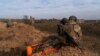 Combat medics train in new tactics for evacuating injured soldiers on the battlefield, in Khurakhove, March 1, 2024. In the last few months, kamikaze drones have been targeting evacuations of injured soldiers more frequently. 