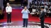 Dari kiri; Ganjar Pranowo, capres dari PDI-P, Menteri Pertahanan Indonesia dan capres Prabowo Subianto, dan capres Anies Baswedan dalam Debat Capres RI di kantor KPU di Jakarta, 12 Desember 2023. (REUTERS/Ajeng Dinar Ulfiana)