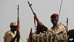 FILE - Sudanese soldiers from the Rapid Support Forces unit secure an area in the East Nile province, Sudan, June 22, 2019. Calls to end Sudan's current 14-month war have come and gone with little effect.