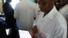 FILE - An Ivorian doctor uses a tablet computer at Bouake hospital's telemedicine department, in Bouake, Ivory Coast, June 20, 2019.