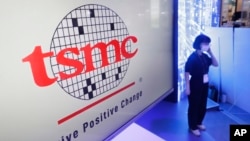 FILE - The logo of TSMC (Taiwan Semiconductor Manufacturing Company) is shown during the Taiwan Innotech Expo at the World Trade Center in Taipei, Taiwan, Oct. 14, 2022. 