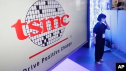 FILE - The logo of TSMC (Taiwan Semiconductor Manufacturing Company) is shown during the Taiwan Innotech Expo at the World Trade Center in Taipei, Taiwan, Oct. 14, 2022.