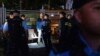 Police officers stop and search people near Victoria Park, Hong Kong's traditional venue for the annual 1989 Tiananmen Square crackdown vigil, in Hong Kong, June 4, 2024.