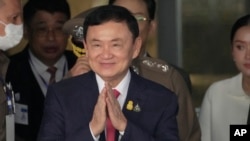 FILE - Thailand's former Prime Minister Thaksin Shinawatra arrives at Don Muang airport in Bangkok, Thailand, Aug. 22, 2023.