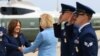 Vice President Kamala Harris, left, is greeted by Democratic Sen. Tammy Baldwin of Wisconsin before boarding Air Force Two to depart on campaign travel to Milwaukee, July 23, 2024 at Andrews Air Force Base, Maryland.