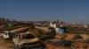Burned cars remain where four Palestinians were killed in an attack by Jewish settlers in the small town of Qusra, Oct. 24, 2023.