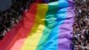 FILE - Participants hold a rainbow flag during a Pride Parade in Bangkok, Thailand, June 4, 2023. 