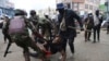 A protester is arrested in Nairobi, Kenya, Aug. 8, 2024, during a demonstration against hunger. 