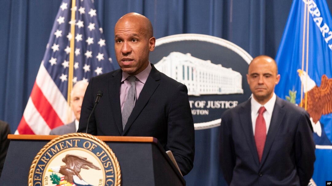 Under Secretary of the Treasury for Terrorism and Financial Intelligence Brian Nelson, with U.S. Attorney Matthew Graves for the District of Columbia, speaks at the Department of Justice in Washington, April 25, 2023. 