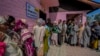 Men and women stand in separate queues to cast their votes during the fourth phase of India's general election, on the outskirts of Srinagar, Indian-administered Kashmir, May 13, 2024.