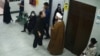 درگیری یک زن با یک آخوند مدافع حجاب اجباری در قم - اسکرین‌شات از تصاویر منتشر شده در رسانه‌ها