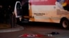 A Nazi flag and other objects recovered from a rented box truck are seen on the ground as law enforcement agencies investigate the truck that crashed into security barriers at Lafayette Park across from the White House in Washington, May 23, 2023.