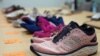 Sepuluh pasang sepatu yang masing-masing dilengkapi alat pelacak dipajang di kantor Reuters di Singapura, 7 September 2022. (Foto: REUTERS/Joseph Campbell)