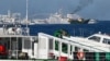 Kapal Garda Pantai China mengerahkan meriam ke arah kapal Unaizah yang disewa oleh militer Filipina untuk membawa pasokan ke beting Second Thomas Shoal di Laut China Selatan, 5 Maret 2024. (Foto: Jam Sta Rosa/AFP)