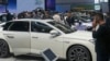 FILE - Visitors look at cars during the China Auto Show in Beijing, China, Apr. 26, 2024. The European Union in July imposed stiff tariffs on vehicles made in China after it found that the automakers got large government subsidies that undermined European rivals.