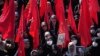 FILE - Mourners in Tehran, Iran, attend the April 4, 2023, funeral procession for Revolutionary Guard members Milad Heidari and Meghdad Mahghani, who were killed by an Israel airstrike in Syria.