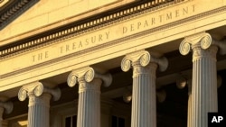 FILE - The U.S. Treasury Department, pictured in Washington on Jan. 18, 2023. The department announced sanctions Thursday on a man from Sierra Leone who is suspected of smuggling thousands of migrants from Asia and Africa into the United States. 