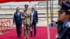 Iraqi Prime Minister Mohammed Shia al-Sudani, left, and Turkish President Recep Tayyip Erdogan, right, attend a welcoming ceremony at Baghdad International Airport, April 22, 2024. (Pool/AP)