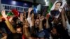 Supporters of former Prime Minister Imran Khan's party, the Pakistan Tehreek-e-Insaf (PTI), celebrate after a high court in Pakistan overturned Khan's conviction on charges of leaking state secrets, in Karachi, Pakistan, June 3, 2024.