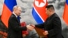 Ruski predsednik Vladimir Putin i severnokorejski Kim Džong UN