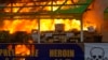 FILE - Smoke and flames billow from burning narcotic drugs during a destruction ceremony of seized drugs on the outskirts of Yangon, Myanmar, on June 26, 2018. Myanmar is the hub of the region's billion-dollar drug trade.