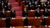 资料照片：习近平（中）出席2023年3月11号在北京召开的中国第十四届人大第一次会议。