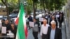 FILE - Iranian Jews in Isfahan walk in a procession holding signs in Persian and English denouncing Israel's war against Hamas, Oct. 30, 2023. (Credit IRNA)