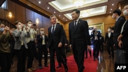 US Secretary of State Antony Blinken (L) walks with China's Foreign Minister Qin Gang (R) ahead of a meeting at the Diaoyutai State Guesthouse in Beijing on June 18, 2023. (Photo by Leah Millis / Pool / AFP)