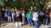A large crowd of Uzbek journalists and activists wait outside Mirabad Disctrict Criminal Court in Tashkent, Uzbekistan, to observe the trial of blogger Abduqodir Muminov, July 25, 2023. (Farukh Samarqandiy/VOA Trainee) 