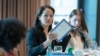 FILE - Freelance reporter Christine Herman, center, speaks at a meeting of the Rosalynn Carter Fellowships for Mental Health Journalism at the Carter Center in Atlanta, Georgia, on Sept. 18, 2019. (The Carter Center/Michael Schwarz)