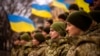 FILE - Ukrainian soldiers celebrate a Day of Unity in Odesa, Ukraine, Feb. 16, 2022. A Ukrainian court recently found blogger Wang Jixian, a software engineer from Beijing who lives in Odesa, guilty of posting videos that could harm national security.