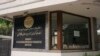 A notice with emergency numbers is seen at the entrance of the Afghan Embassy in New Delhi, India, Nov. 24, 2023, on the day the embassy announced its permanently closure due to challenges from the Indian government a lack of diplomatic support.