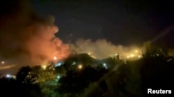 FILE - A view of smoke rising from Evin Prison in Tehran, Oct. 15, 2022 in this still image take from a video obtained by Reuters.