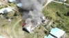 Barak pemuda dan olahraga di Kampung Mamba Kabupaten Intan Jaya, Papua, yang dibakar Kelompok Kriminal Bersenjata (KKB), Selasa 16 Agustus 2022. (Courtesy: Polda Papua)
