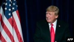 FILE - Former US President Donald Trump takes the stage at a rally in Las Vegas, July 8, 2022.