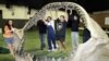 FILE - Workers move a jaw reconstruction of a Charcharodon megalodon in New York on June 21, 2004, in preparation for an auction of dinosaurs and other prehistoric creatures.
