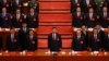 FILE - Chinese President Xi Jinping and his cadres sing the Communist song during the closing ceremony for the 19th Party Congress held at the Great Hall of the People in Beijing on Oct. 24, 2017.