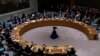 At the U.N. on Feb. 25, 2022, Russia's Vassily Nebenzia keeps his hand down during a vote on a draft resolution that would condemn Russia for invading Ukraine.
